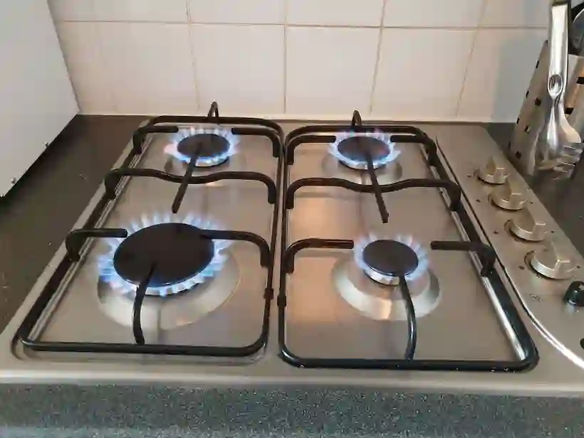 Lit gas hob with blue flames — gas engineer work by Marple Flame